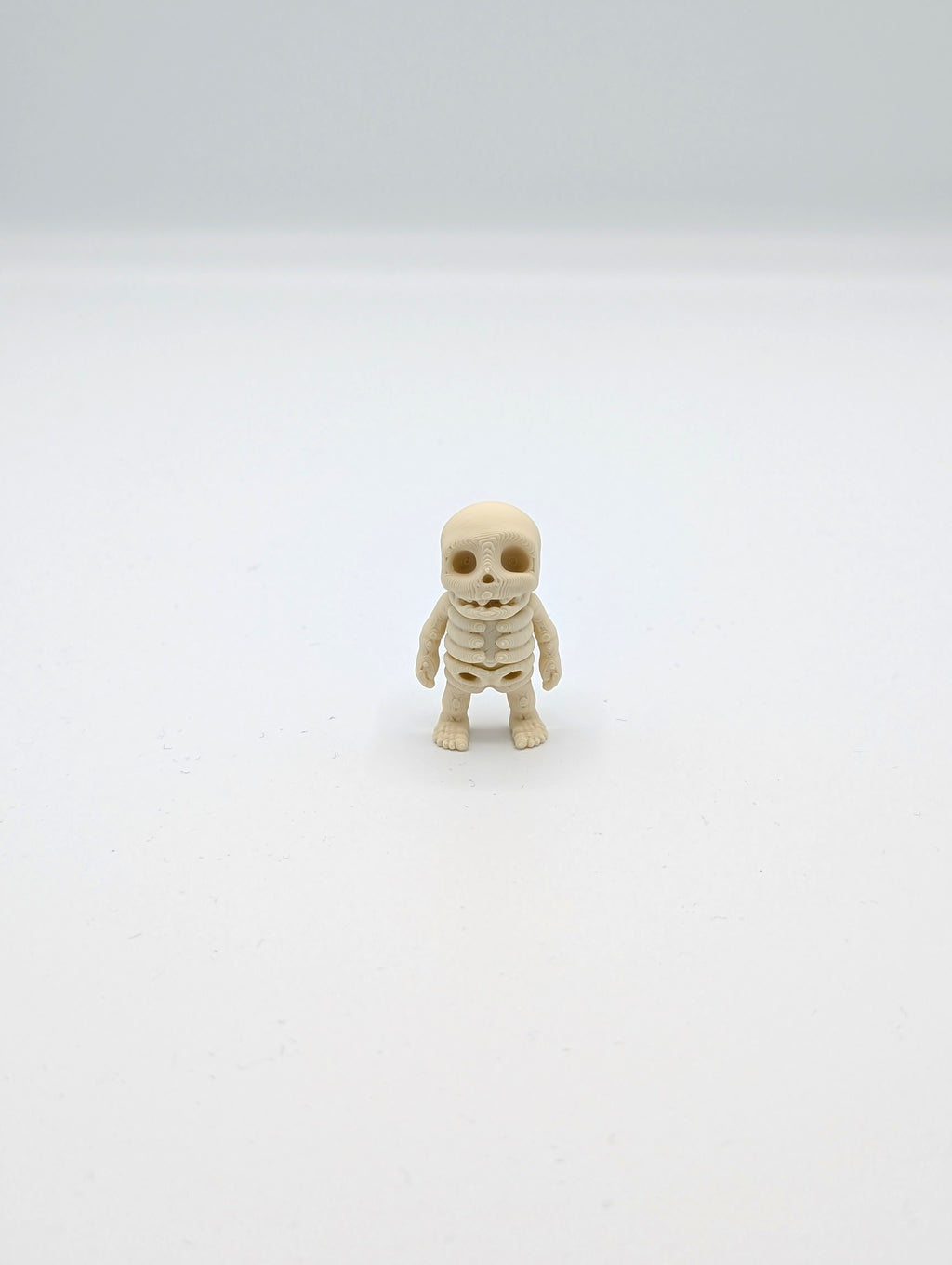 Mini skeleton fossil fidget man