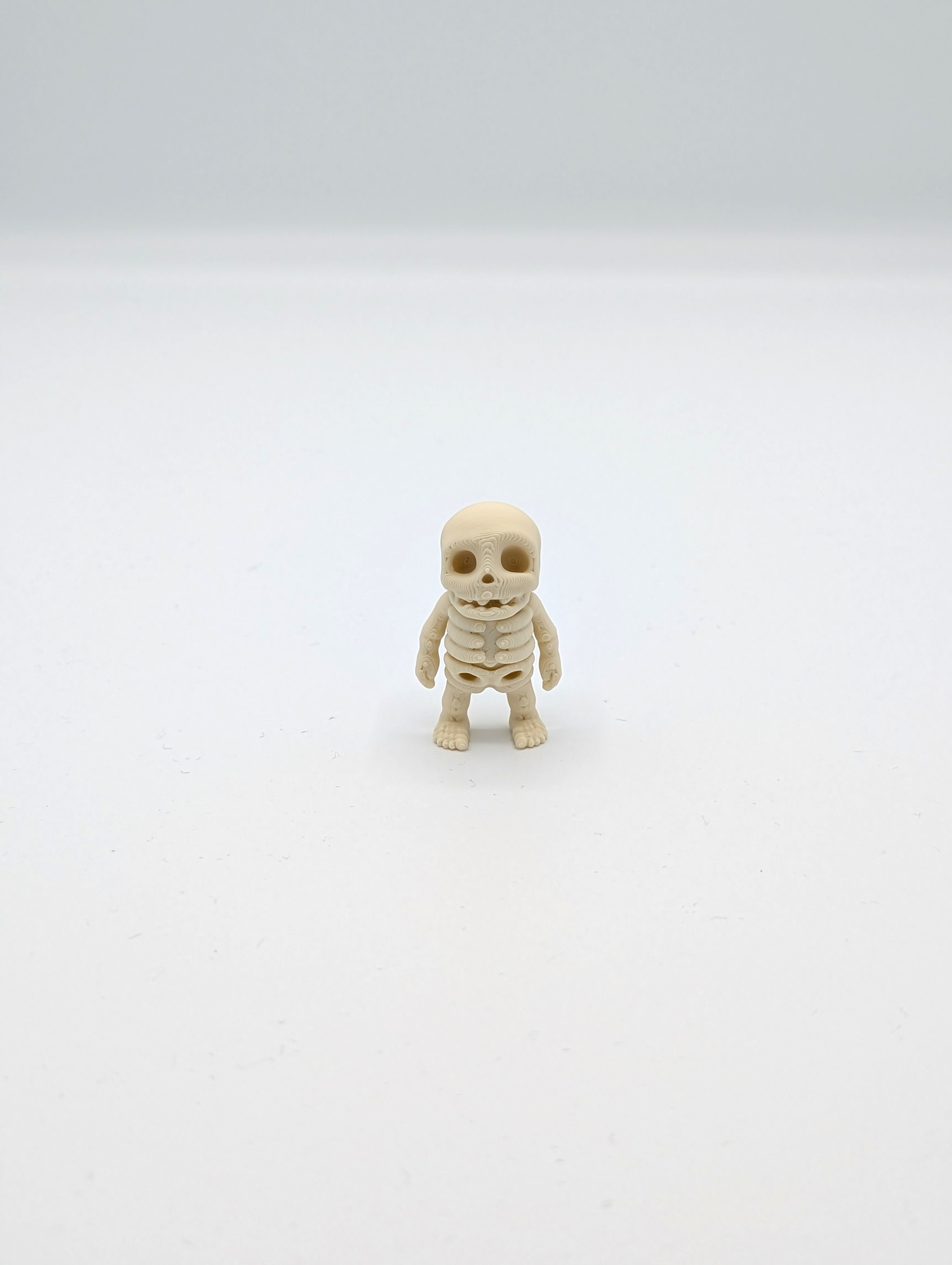 Omino scheletro fossile mini fidget