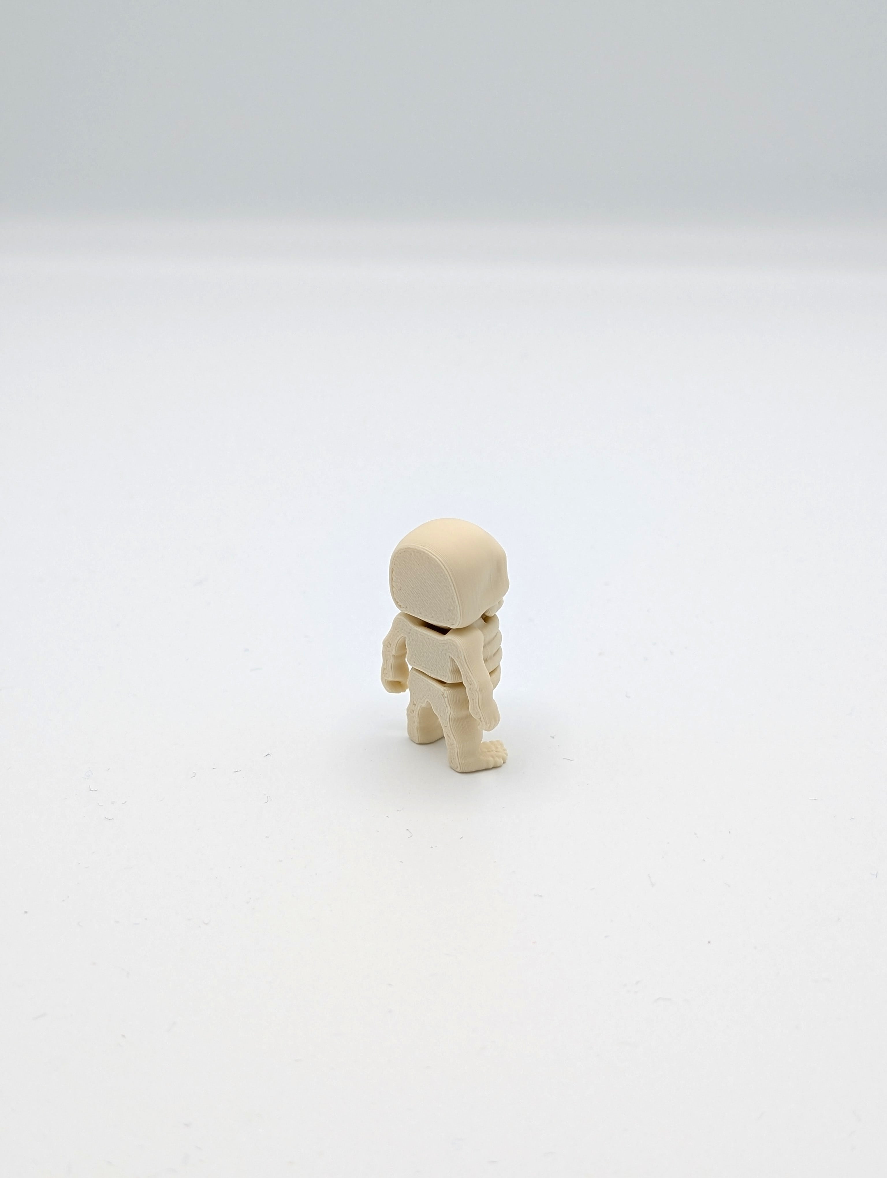 Omino scheletro fossile mini fidget