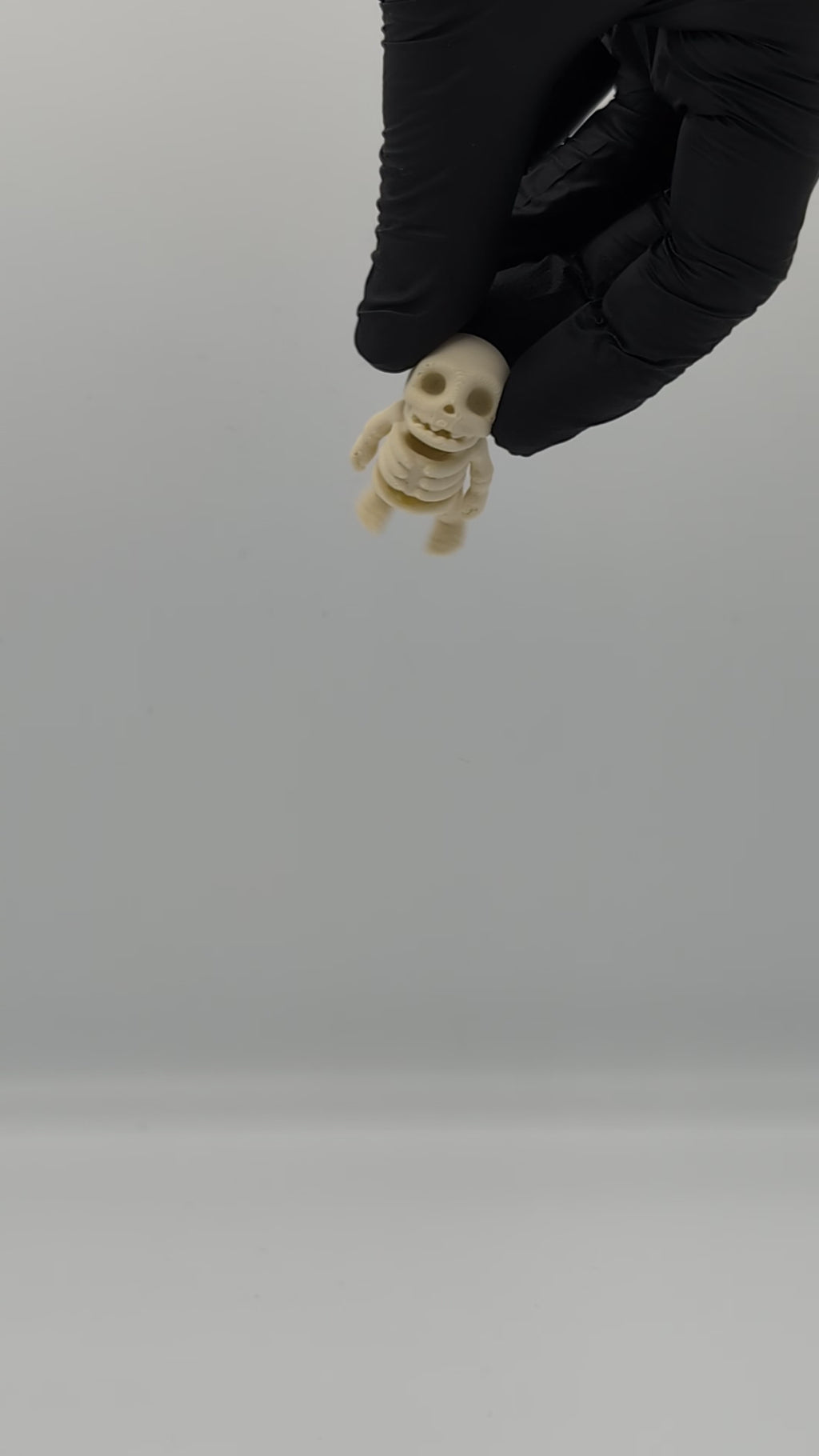 Mini skeleton fossil fidget man